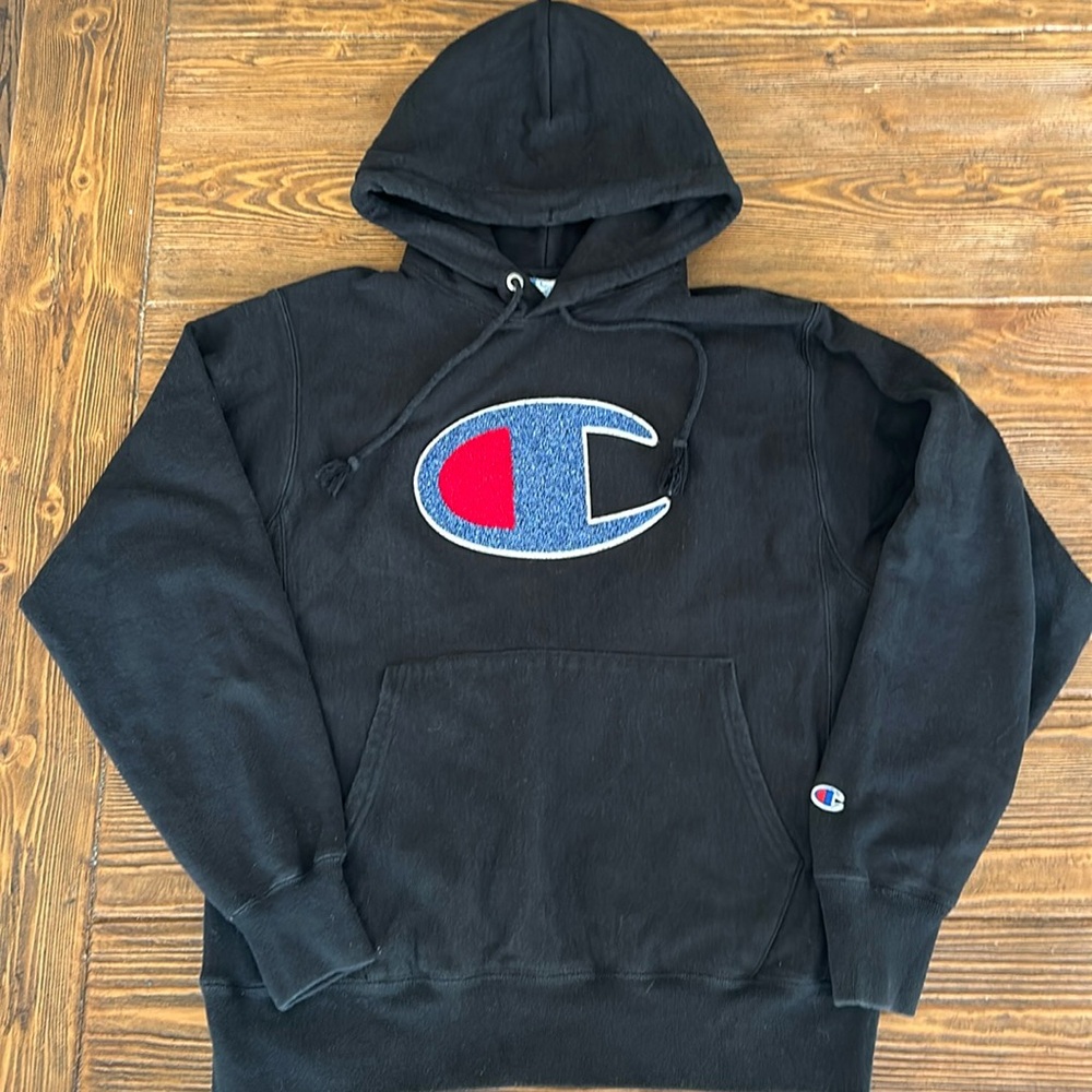 Champion reverse weave hoodie in black with letterman style big C.